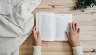photo of person holding a book